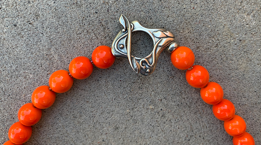Necklace Set | Clear/orange/white baroque ovals and vivid orange vintage glass rounds