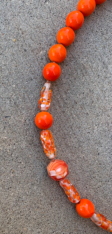 Necklace Set | Clear/orange/white baroque ovals and vivid orange vintage glass rounds