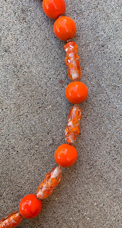 Necklace Set | Clear/orange/white baroque ovals and vivid orange vintage glass rounds