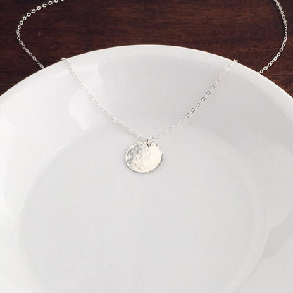 Classic hammered sterling silver disc necklace
